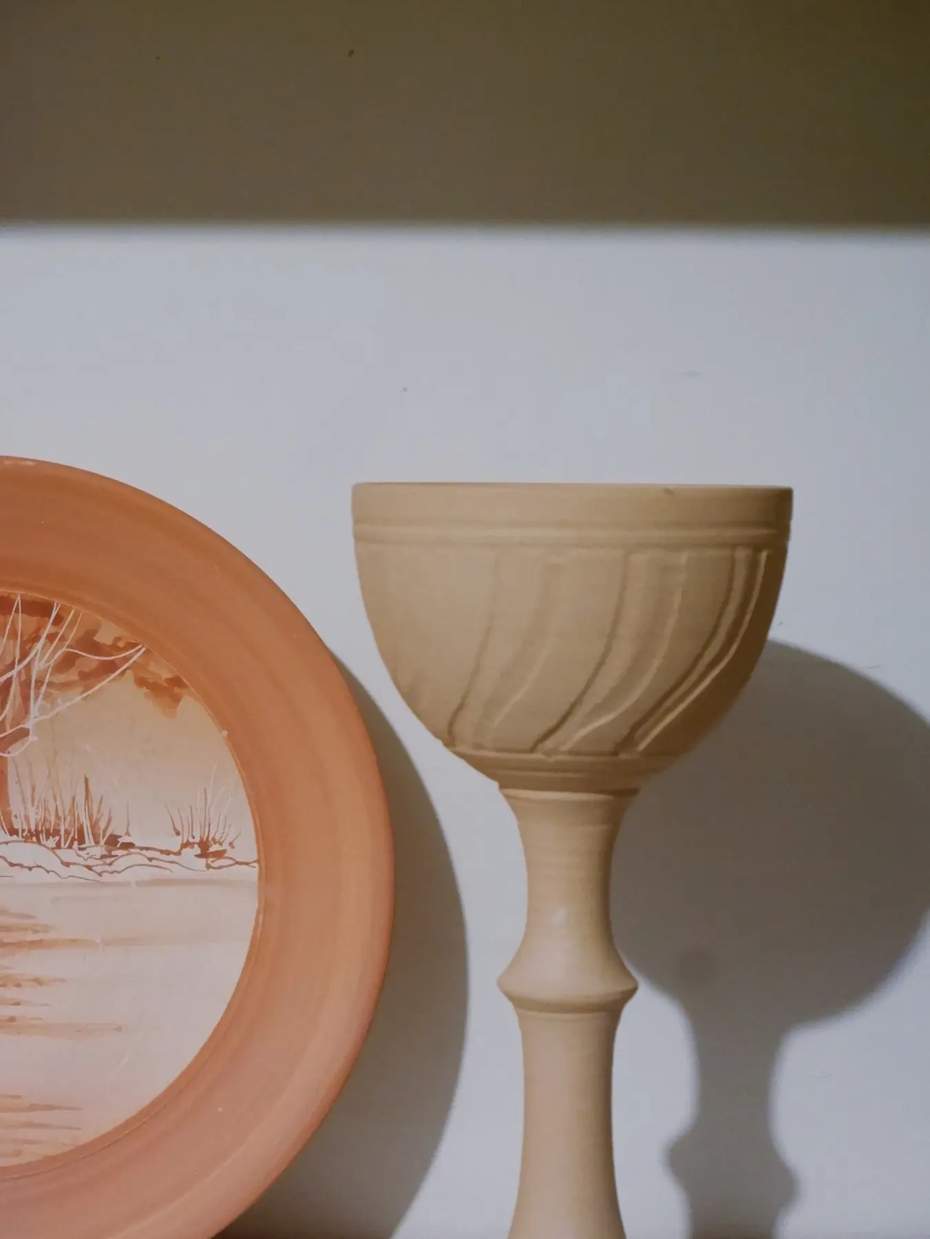 Tall ceramic pieces in a studio display